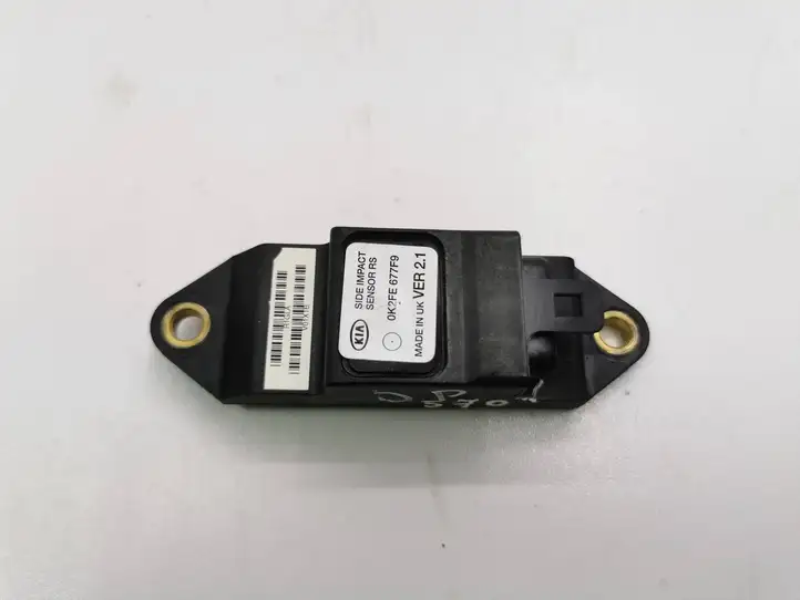 Kia Carens I (2002 - 2006) 0K2FE677F9 Датчик удара SRS — фото 1