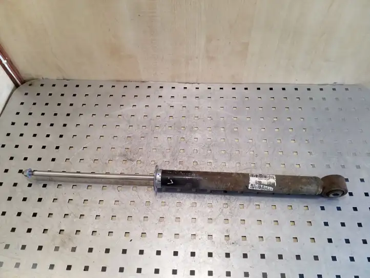 Opel Astra (2009 - 2012)  13279263 Задний амортизатор с пружиной