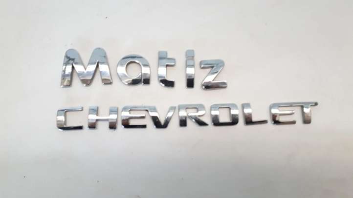 Chevrolet Matiz Gamintojo ženkliukas/ modelio raidės