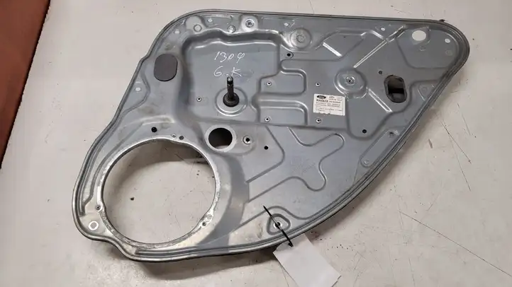 Ford Focus (1998 - 2004) 4M51A24994CE Механический стеклоподъемник задней двери — фото 1