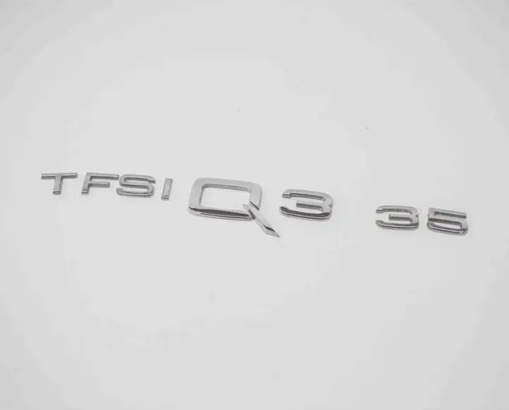 Audi Q3 F3 (2018 - ) Эмблема производителя — фото 1