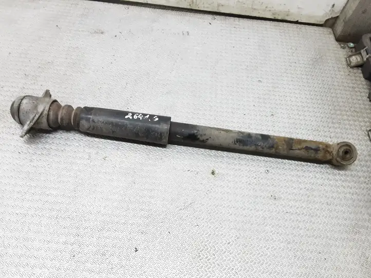 Volkswagen  New Beetle (1997 - 2005)   Задний амортизатор с пружиной