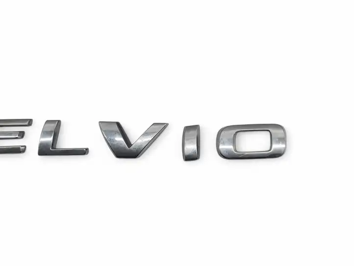 Alfa Romeo Stelvio Type 949 (2017 - ) Эмблема модели — фото 4