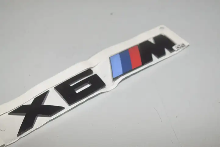 BMW X6M G06 F96 (2019 - ) Эмблема производителя — фото 2