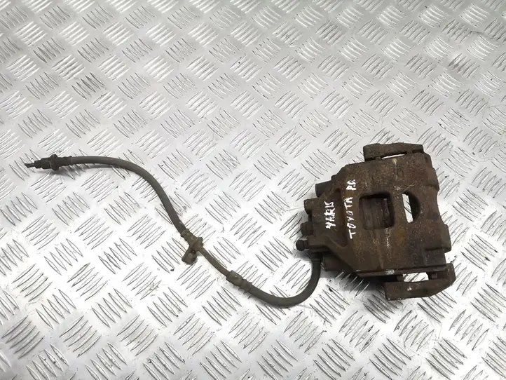 Toyota Yaris (2005 - 2009) Тормозной суппорт передний — фото 1