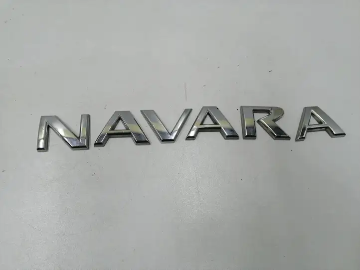 Nissan Navara D40 (2004 - 2015) Эмблема модели — фото 1