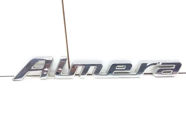 Nissan Almera Tino (2000 - 2003) 90895BM400 Эмблема производителя — фото 1