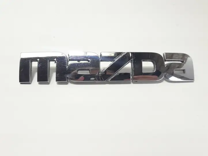 Mazda Premacy (1999 - 2005) 10051710 Эмблема производителя — фото 1