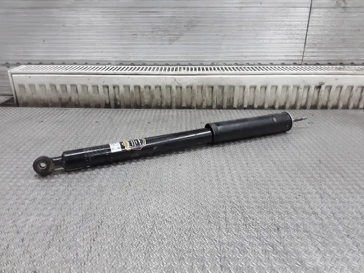 Nissan Primera (2001 - 2008)  423093JP Задний амортизатор с пружиной