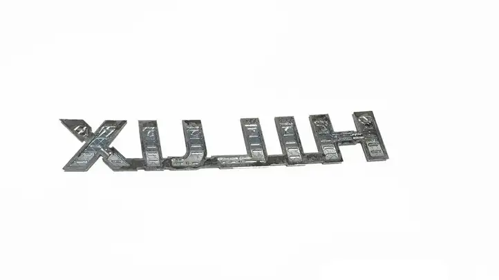 Toyota Hilux (AN10, AN20, AN30) (2011 - 2015) 754270K030 Эмблема модели — фото 2