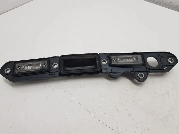 Volkswagen Touran I (2003 - 2010) 1T0827574L Подсветка номера — фото 1