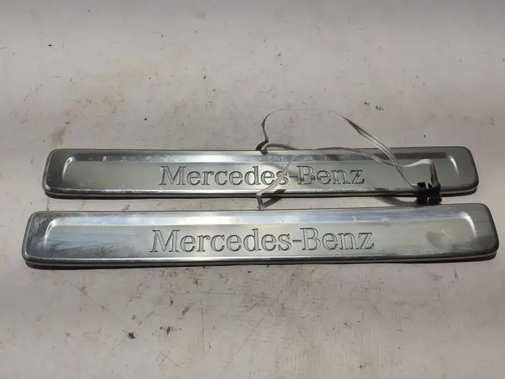 Mercedes-Benz C W206 (2021 - ) A2066801801 Внутренняя отделка переднего порога — фото 1