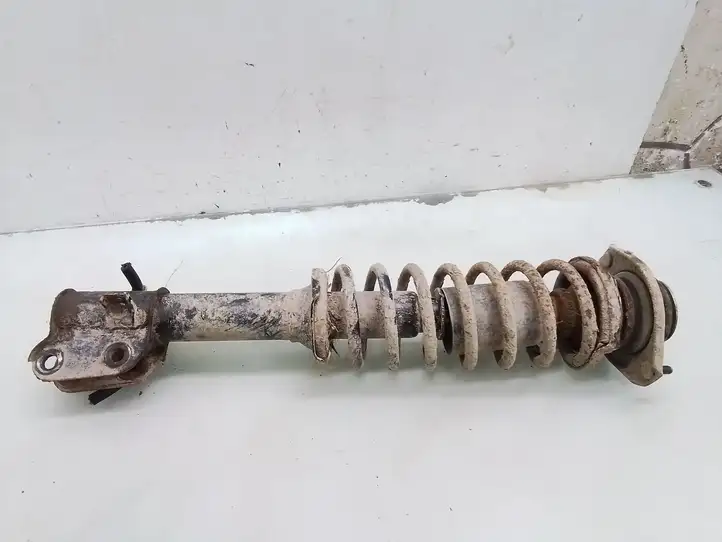 Suzuki Ignis (2000 - 2003) Передняя стойка амортизатора — фото 1