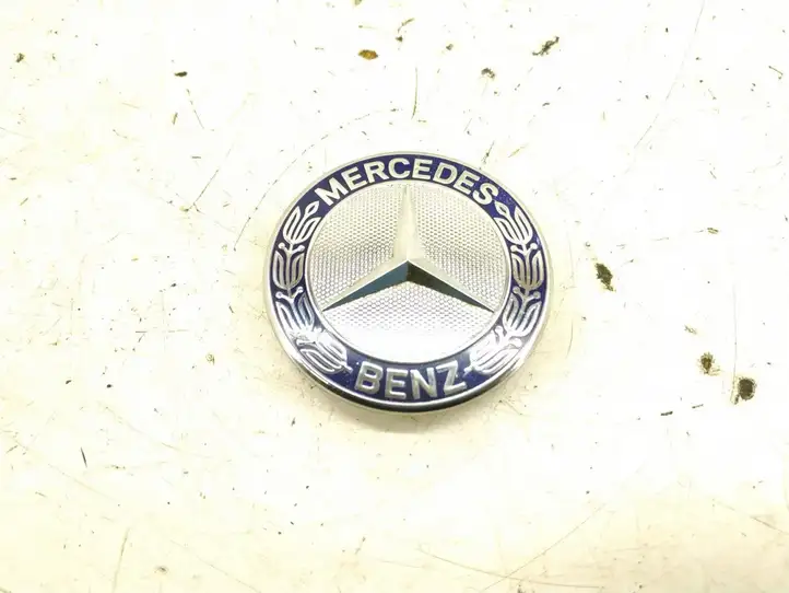 Mercedes-Benz ML W164 (2005 - 2011) 1298880116 Эмблема автомобиля — фото 1