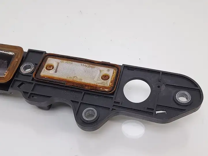 Volkswagen Touran I (2003 - 2010) 1T0827574L Подсветка номера — фото 6