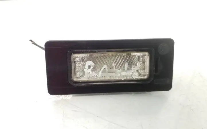 Volkswagen PASSAT B6 (2005 - 2010) 8T0943021 Подсветка номера — фото 1