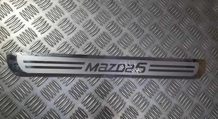 Mazda 6 (2012 - 2015) Внутренняя отделка переднего порога — фото 1
