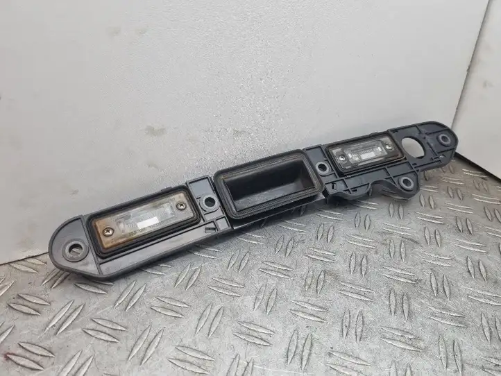 Volkswagen Touran I (2003 - 2010) 1T0827574H Подсветка номера — фото 1
