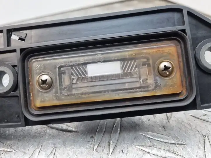 Volkswagen Touran I (2003 - 2010) 1T0827574H Подсветка номера — фото 7