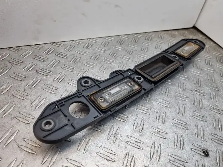 Volkswagen Touran I (2003 - 2010) 1T0827574H Подсветка номера — фото 10