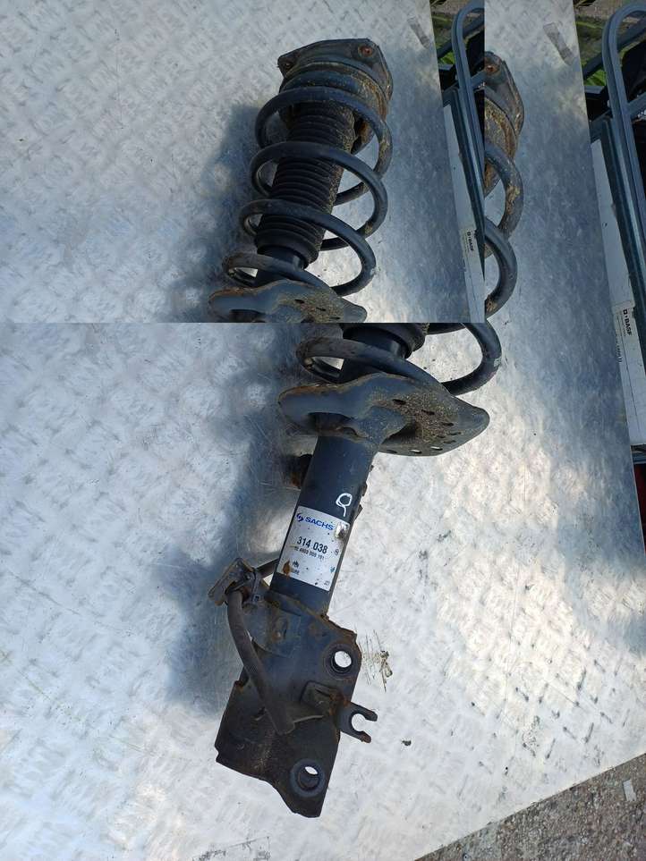 Nissan Qashqai (2010 - 2013)   Передний амортизатор с пружиной