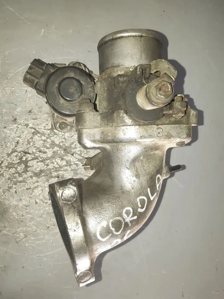 Toyota Corolla E120 E130 (2004 - 2007) 27020 Дроссельная заслонка — фото 1