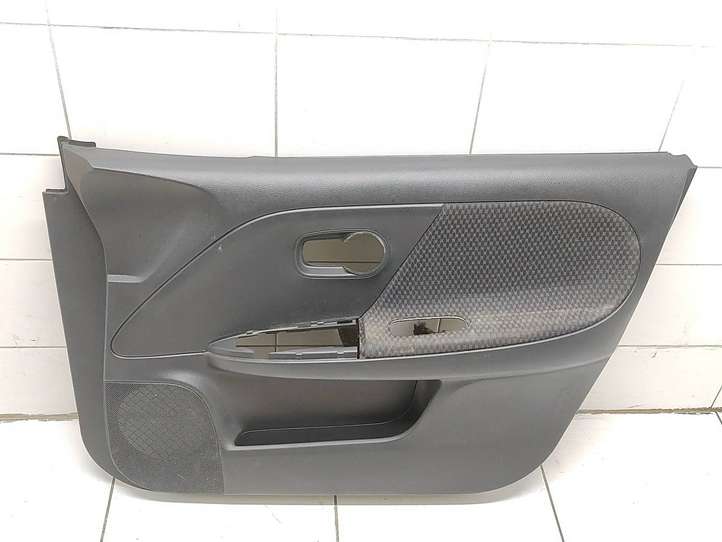 Nissan Note (E11) (2006 - 2014)  809229U000 Обшивка передней двери