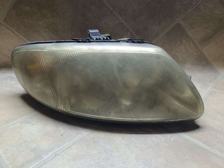 Chrysler Voyager (2004 - 2007)  04857702AB Передняя фара