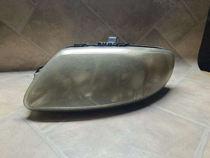 Chrysler Voyager (2004 - 2007)  04857703AB Передняя фара