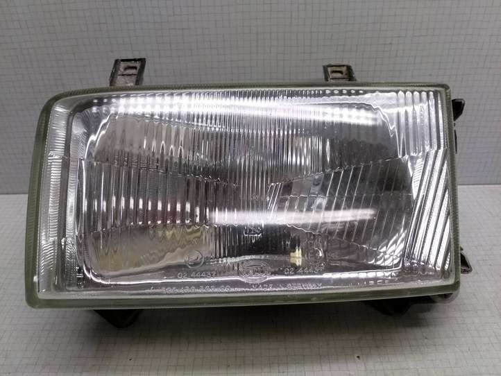 Volkswagen Transporter-Caravelle (1990 - 2003)  0244437 Передняя фара