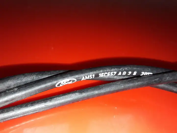 Ford Focus (2011 - 2015) AM5116C657AG Трос капота — фото 3