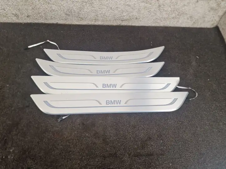 BMW 7 G11 G12 (2015 - 2022) 7370314 Внутренняя обшивка порога (комплект) — фото 1