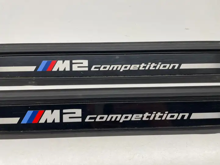 BMW M2 F87 (2018 - ) 7345103 Внутренняя обшивка порога (комплект) — фото 5