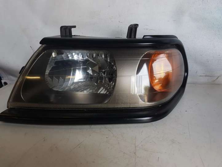 Mitsubishi Pajero Sport (1996 - 2004)  10087415 Передняя фара