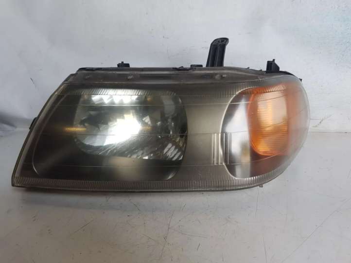Mitsubishi Pajero Sport (1996 - 2004)  10087415 Передняя фара