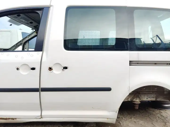 Volkswagen Caddy (2010 - 2015) Боковая раздвижная дверь — фото 1