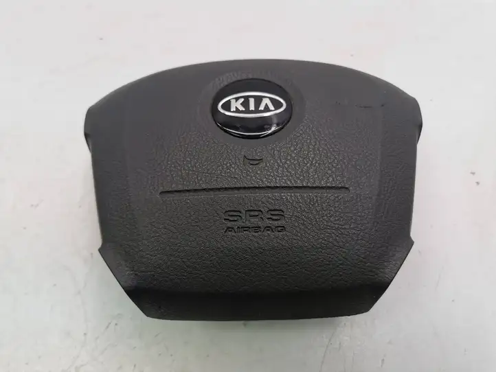 Kia Carens I (2002 - 2006) FJ56900010GW Подушка безопасности руля — фото 1