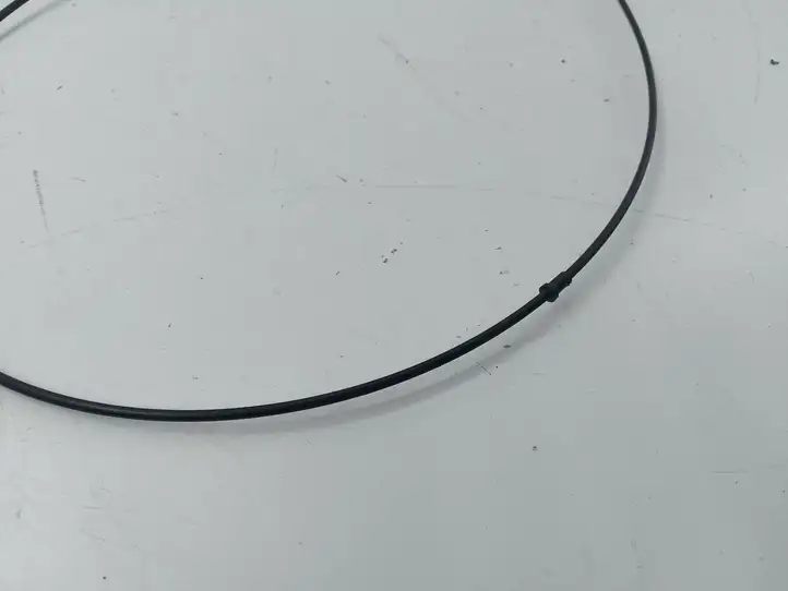 Mazda CX-7 (2006 - 2009) Трос капота — фото 5