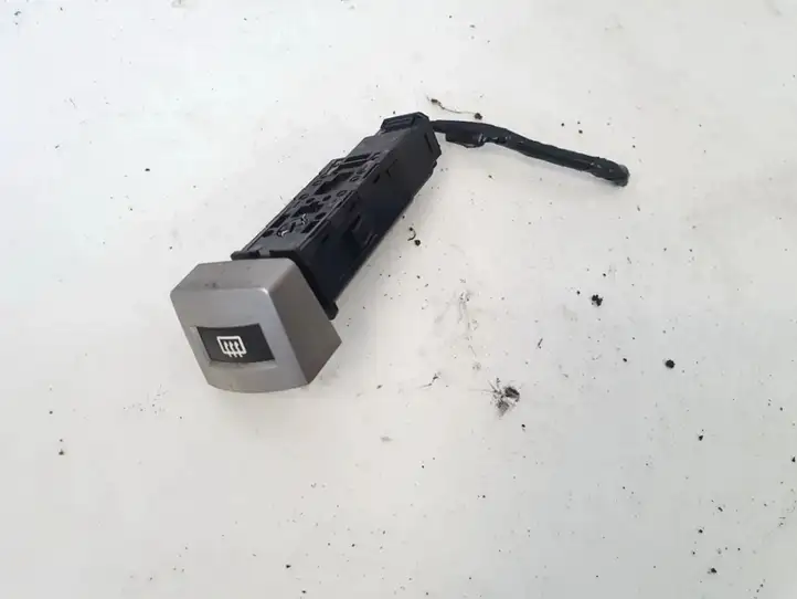 Kia Carnival (1997 - 2002)   Включатель обогрева стекла с помощью электричества